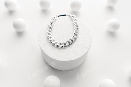 Preview: Silver bijouterie chain bracelet on white background.