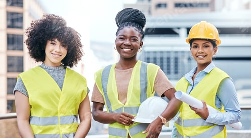 Preview: Portrait of a group of confident young businesswomen working at a construction site