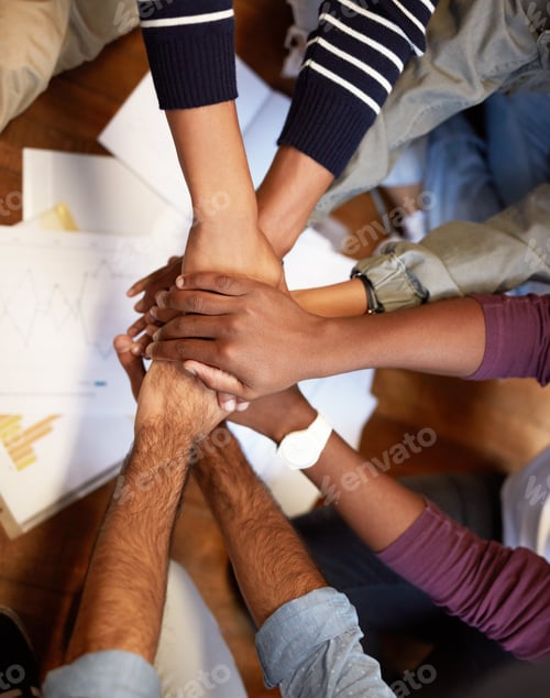 Preview: Weve got this. High angle shot of a group of people joining their hands together.