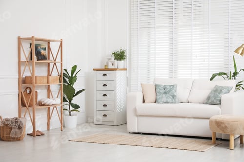 Preview: Stylish shelving unit with decor and sofa in room