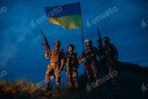 Preview: Portrait of Ukrainian warriors with a national flag in the evening