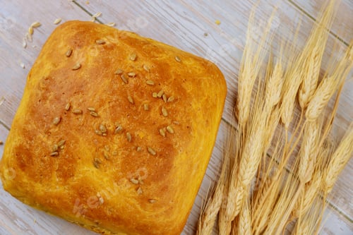Preview: Fresh baked bread with ears of wheat. Thanksgiving background.
