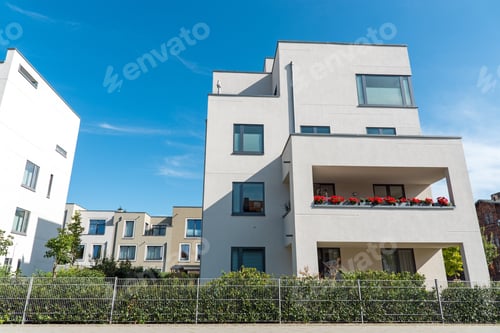 Preview: White modern houses in front of a blue sky