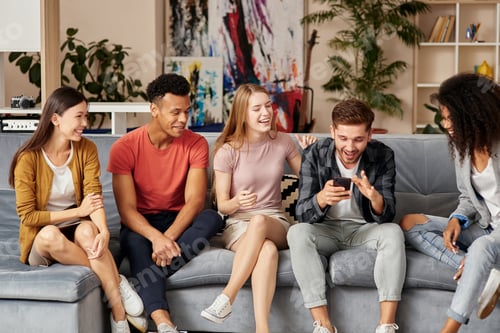 Preview: All you need is friends. Group of happy young multicultural people in casual wear looking