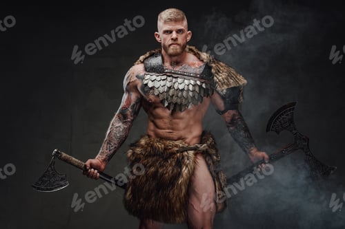 Preview: Strong tattooed warrior in light armour and fur with two axes in dark