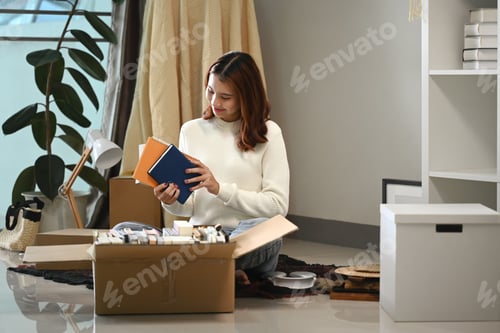 Preview: Pretty young asian woman unpacking her things and stuff, moving into new home