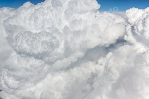 Preview: Fluffy white clouds, a view from airplane window
