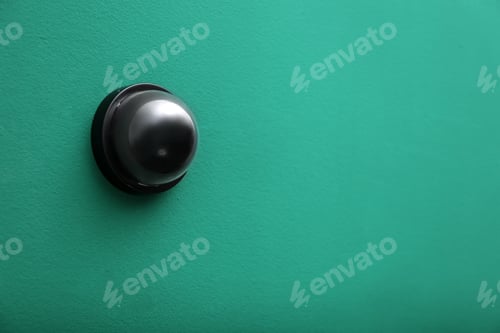 Preview: Modern CCTV security camera on green wall. Space for text