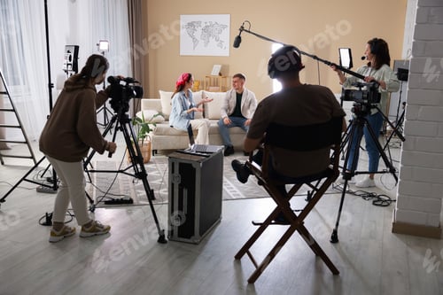 Preview: Group of people working in modern film studio