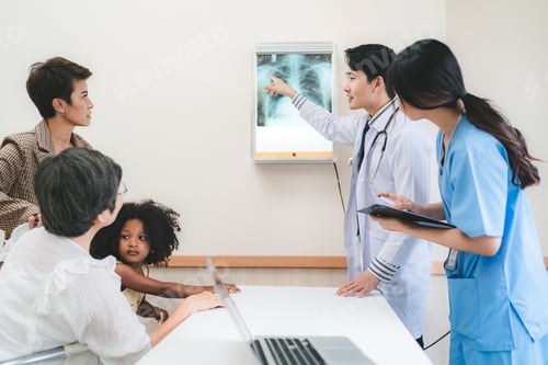 Preview: young Asian male doctor and female nurse in lab coat with stethoscope in conversation