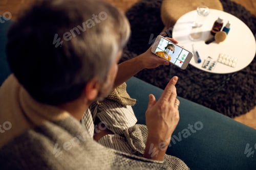 Preview: Close-Up Of Man Using Phone And Making Video Call His Female Colleague In The Evening From Home Due