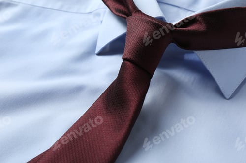 Preview: Classic male necktie on blue shirt, closeup