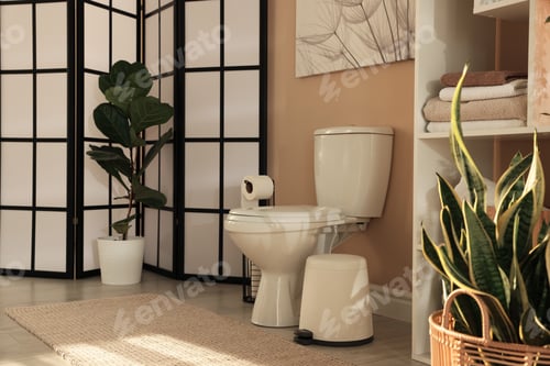 Preview: Ceramic toilet bowl, houseplants and necessities in restroom