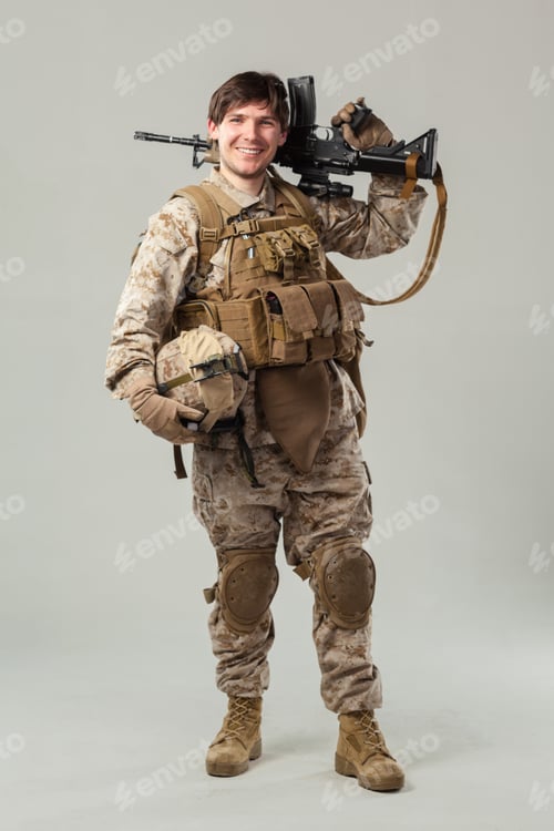 Preview: Soldier holding weapon and gear during military training in a studio setting