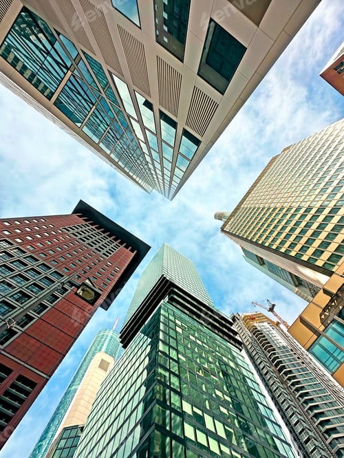 Preview: View From Below To Tops Of Glass Modern Architecture Buildings on Blue Sky Background In Frankfurt
