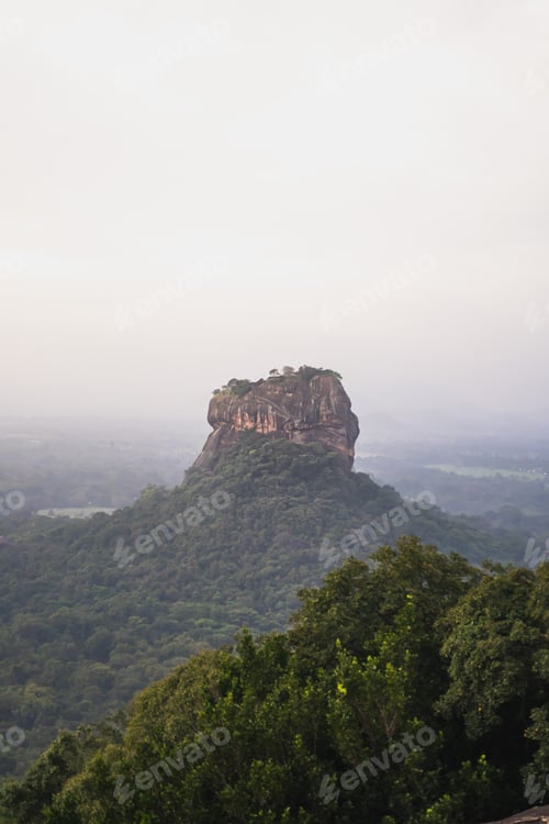 Preview: Hazy and moody morning photo of Sigiriya Lion Rock from Pidarangula Rock