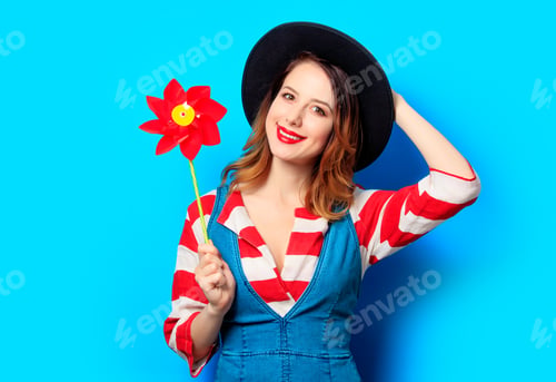 Preview: smiling woman with red pinwheel