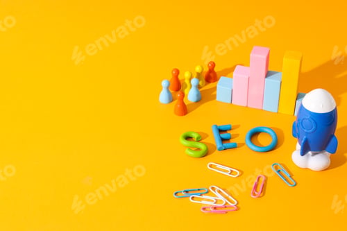 Preview: Diagram, clips, toy rocket and letters on yellow background, space for text