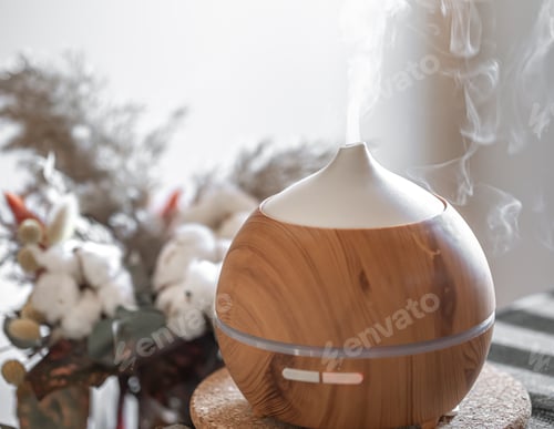 Preview: Modern oil aroma diffuser close up on a blurred background.