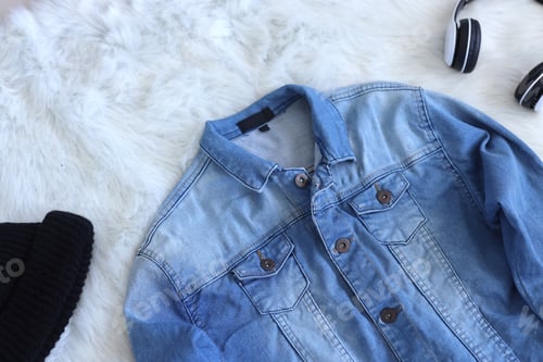 Preview: Denim Jacket, Hat, and Headphones on Fluffy Blanket