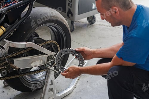 Preview: Man working in his motorcycle workshop with the transmission