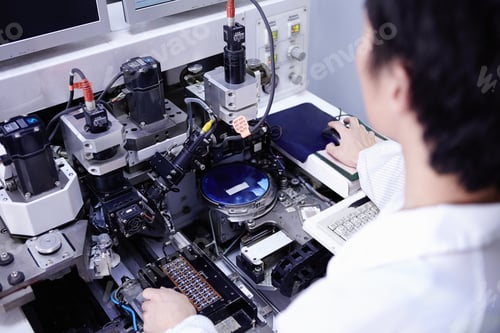 Preview: Technician working in LED factory