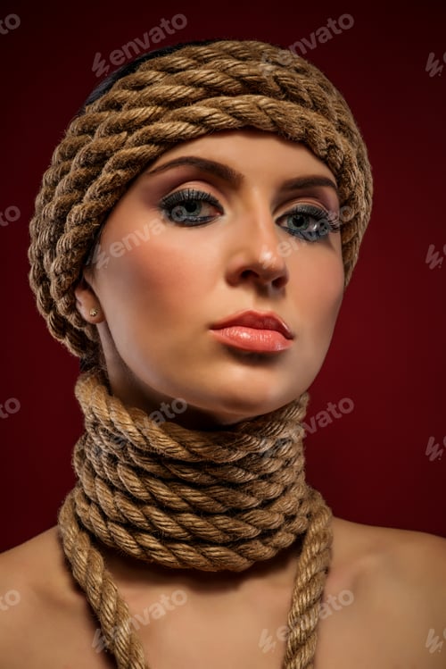 Preview: Portrait of a beautiful young woman with ropes