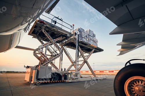 Preview: Preparation before flight. Loading of cargo containers to airplane at airport.