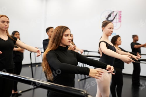 Preview: Male And Female Students At Performing Arts School Rehearsing Ballet In Dance Studio Using Barre