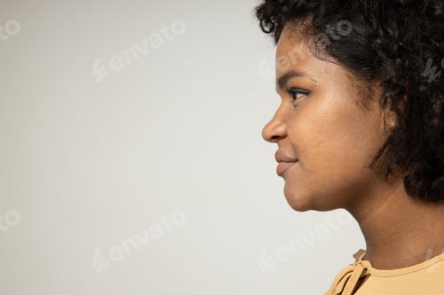 Preview: Curly woman in profile on white background, space for text
