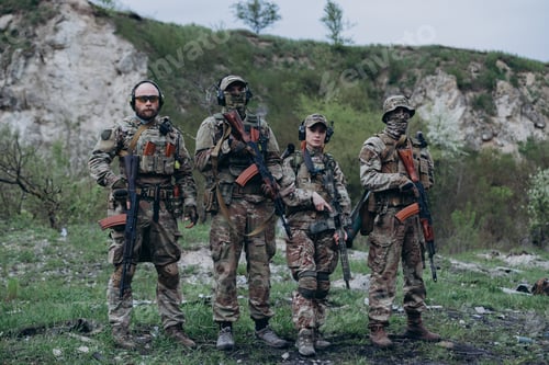 Preview: Portrait of four armed Ukrainian soldiers looking in the camera
