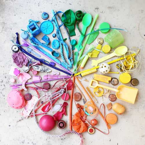 Preview: Rainbow colour wheel made with plastic pollution ocean debris found on beach