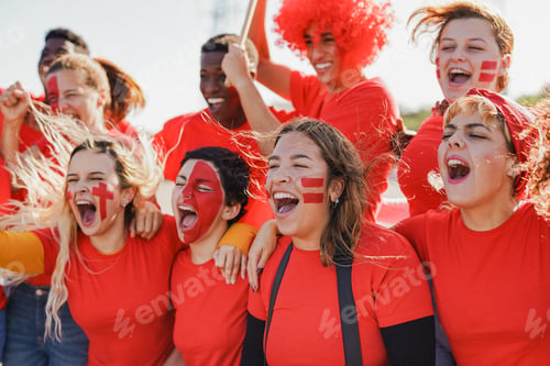 Preview: Multi generational people having fun screaming outside of football stadium