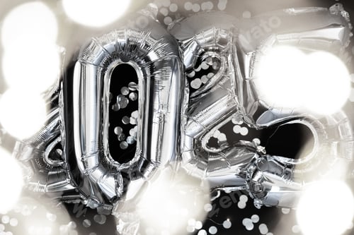 Preview: Holiday bokeh garland Happy new year 2025 metallic balloons with confetti on dark black background