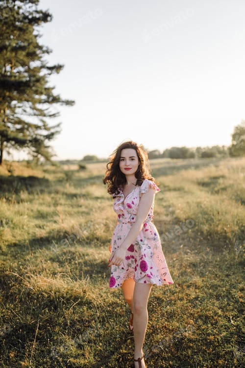 Preview: Young woman walking in forest