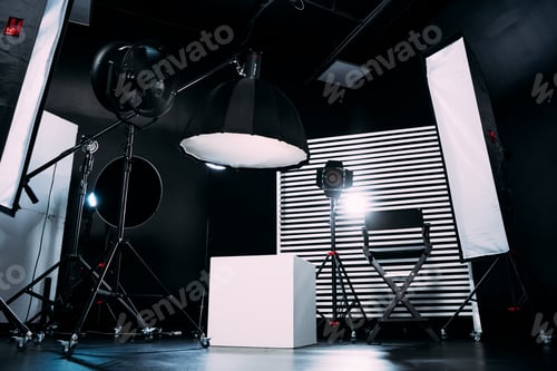 Preview: Modern photo studio with professional equipment. Black cyclorama.