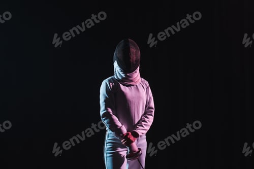 Preview: Fencer in fencing suit and mask holding rapier isolated on black