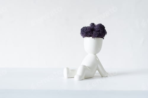 Preview: White ceramic figurine of human with colorful stabilized moss from head is sitting whit hands back