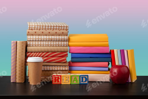 Preview: Stack of books on black wooden table