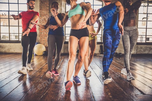 Preview: Athletes training in a gym