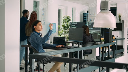 Preview: Digital developer analyzing ar hologram to work on html script