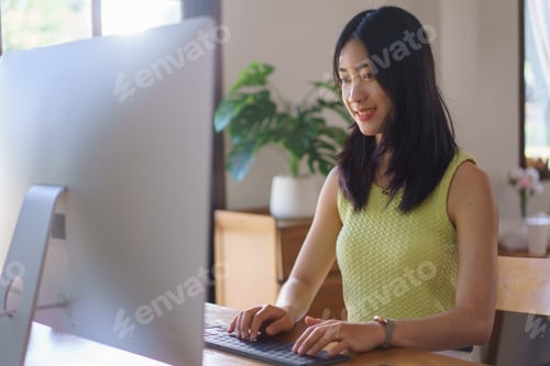 Preview: Hand embroidery concept, Women is typing and working on computer about handicraft of embroidery