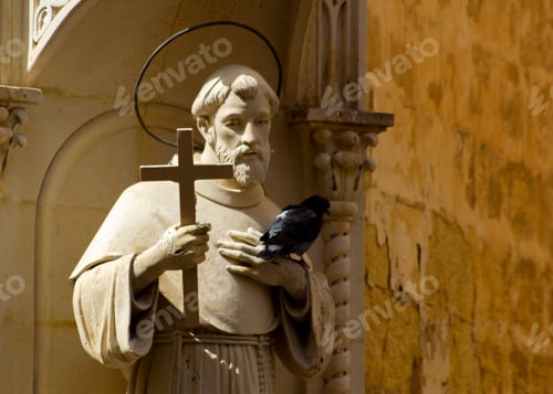 Preview: Close up of Statue of St Francis in Republic Street Valletta Malta corner with Melita Street