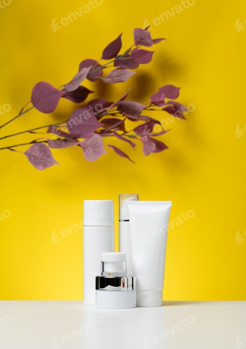 Preview: Empty white plastic tubes and jars for cosmetics