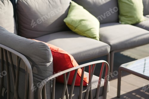 Preview: modern grey sofa with pillows in living room at home