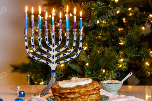 Preview: Jewish holiday dinner with menorah and crispy potato latkes.