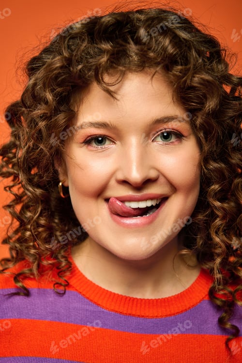 Preview: Playful portrait of a young woman with curly hair