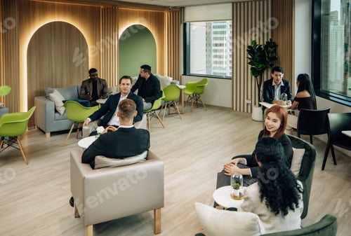 Preview: Diverse businesspeople collaborate at cozy conference, exchanging ideas and partnerships for growth