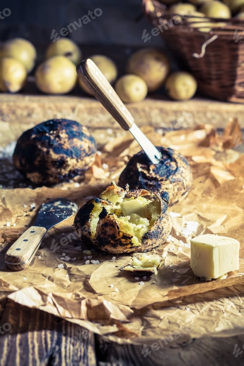 Preview: Closeup of jacket potatoes with butter