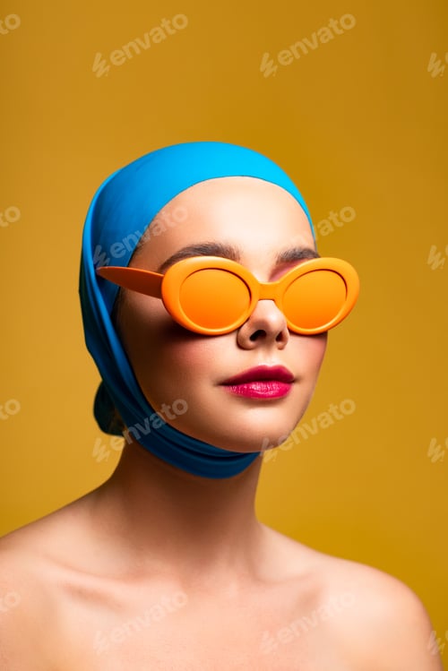 Preview: attractive naked woman in scarf and fashionable sunglasses, isolated on yellow